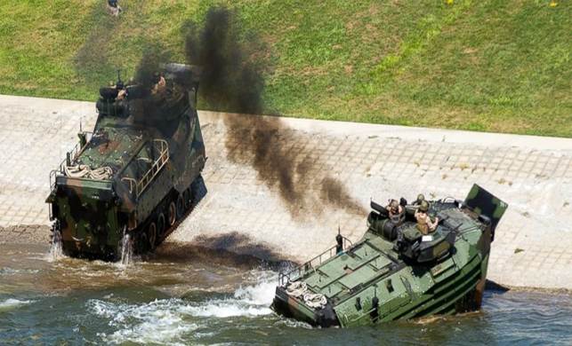 This Sept. 6, 2016, photo released by the U.S. Marine Corps shows Marines with the 2nd Amphibious Assault Battalion aboard AAV-7 Amphibious Assault vehicles during an exercise on the Cumberland River in Nashville, Tenn. The Marine Corps said Wednesda